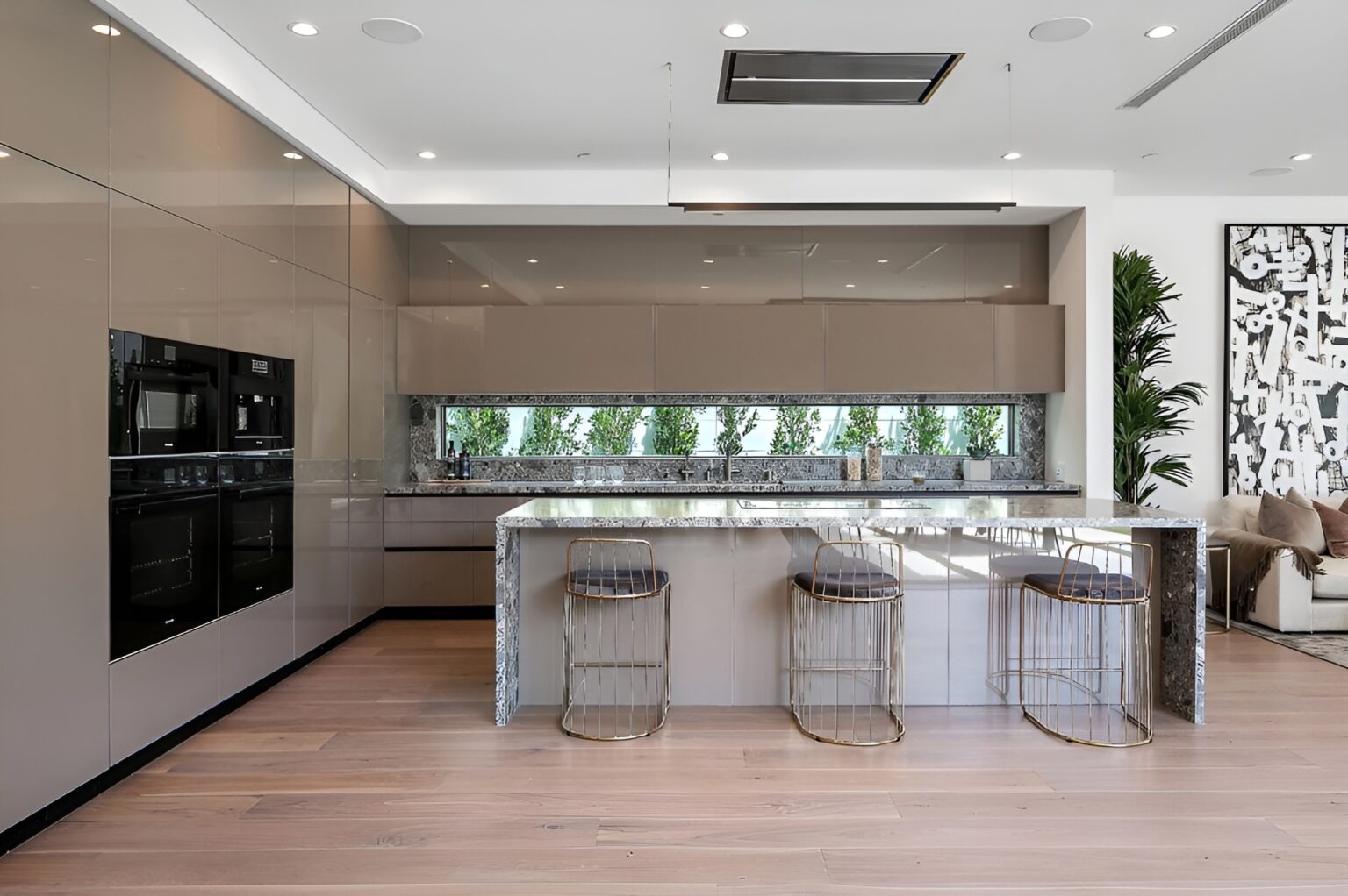 Kitchen Remodeling in Dublin 32 a kitchen with a bar and stools. The best home remodeling in Berkeley from Geico Builders