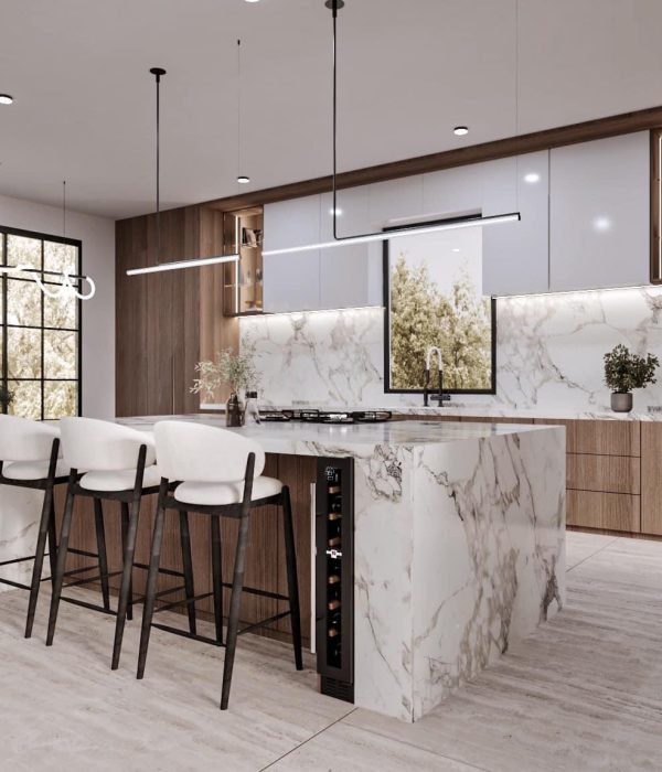 Kitchen Remodel 43 a kitchen with a marble island and chairs