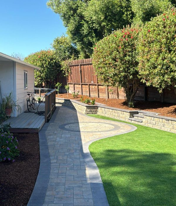 474542185_122167024484278422_8189321133244880559_n a walkway with a brick walkway and a fence and trees. Expertly installed retaining walls in Berkeley