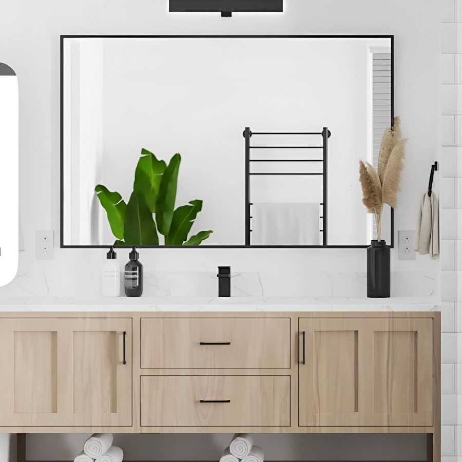 476751029_17920639755046845_5791508614470929112_n (1) Bathroom with light wood vanity and large mirror surrounded by decorative plants