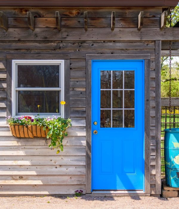 ADU Builder 54 rustic-shed-with-bright-blue-door-2024-12-03-09-37-16-utc
